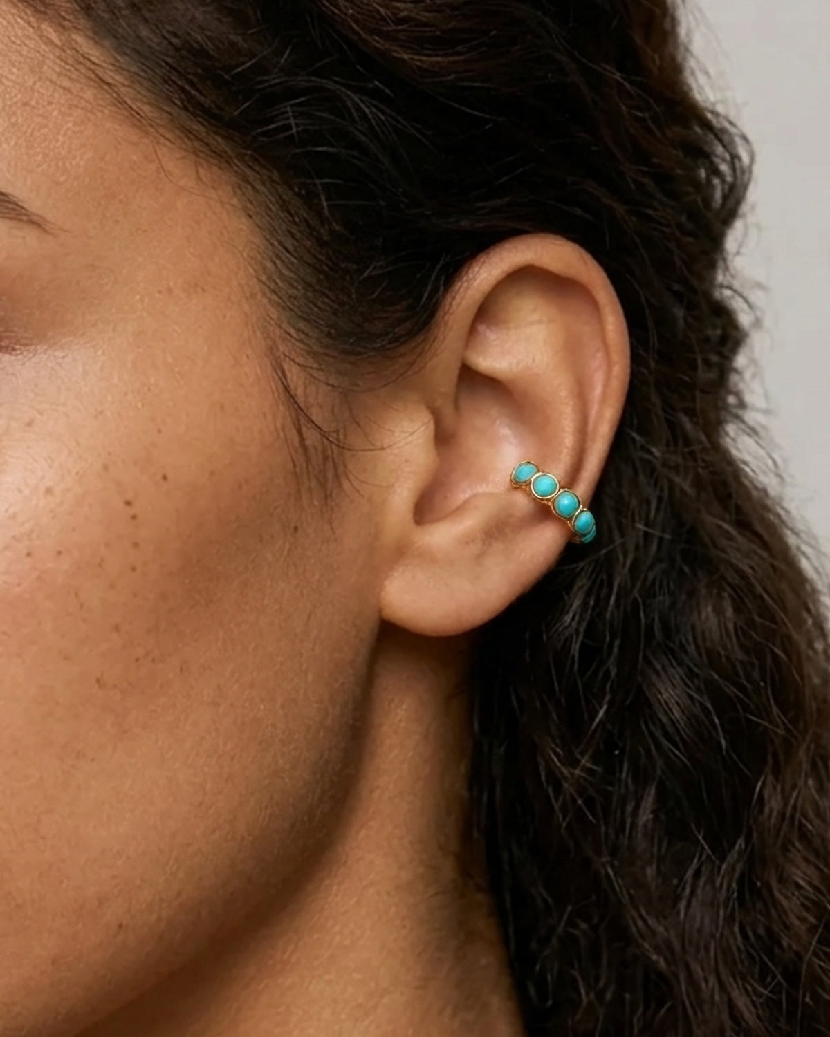 Model wearing 18K gold plated turquoise ear cuff — HYFN