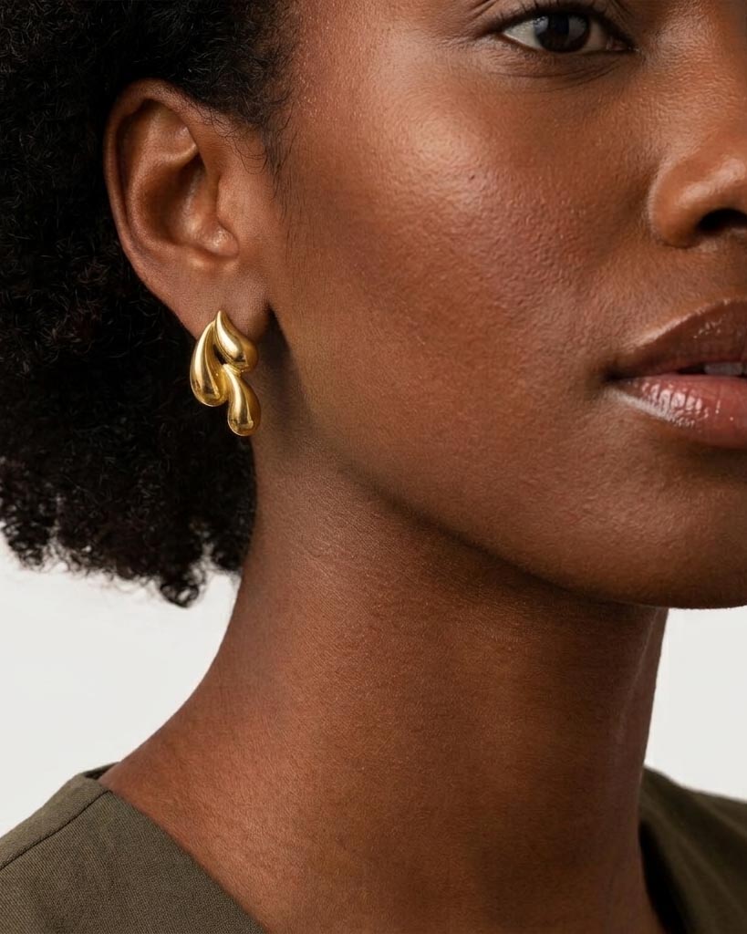 Model wearing 18K gold plated chunky teardrop statement stud earrings — HYFN