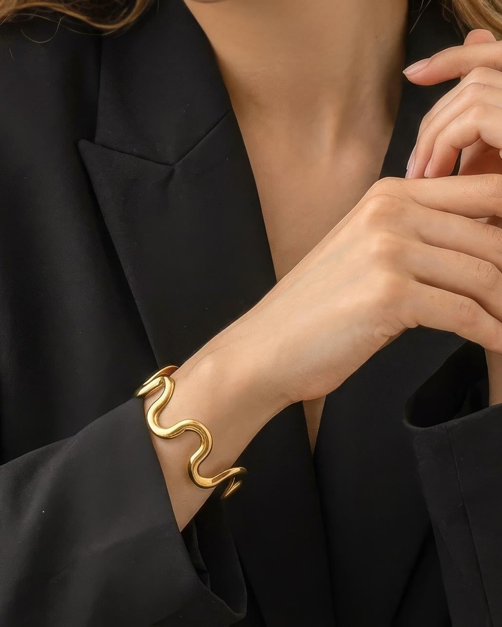 Model wearing 18K gold plated wave statement cuff bracelet — HYFN