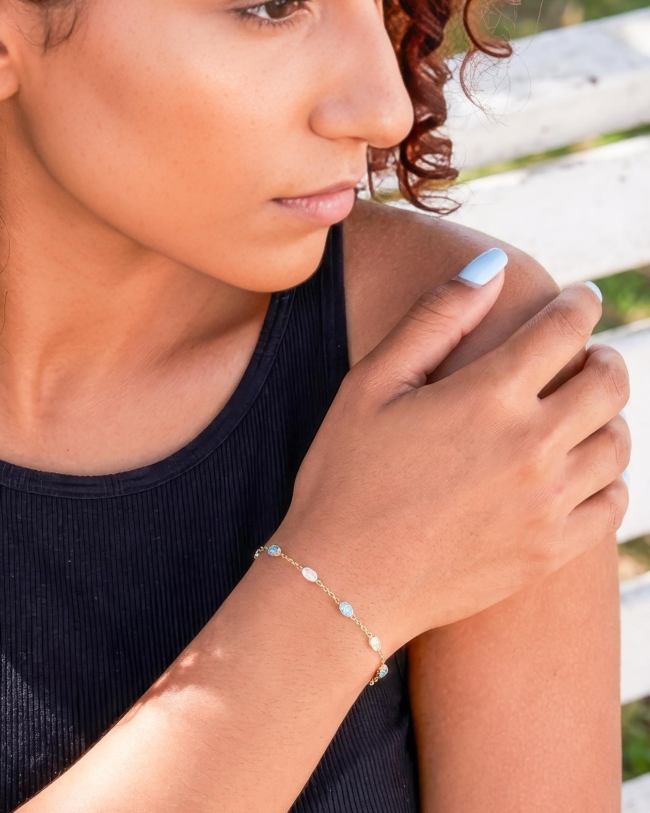 Model wearing 18K gold plated blue zircon station chain bracelet — HYFN