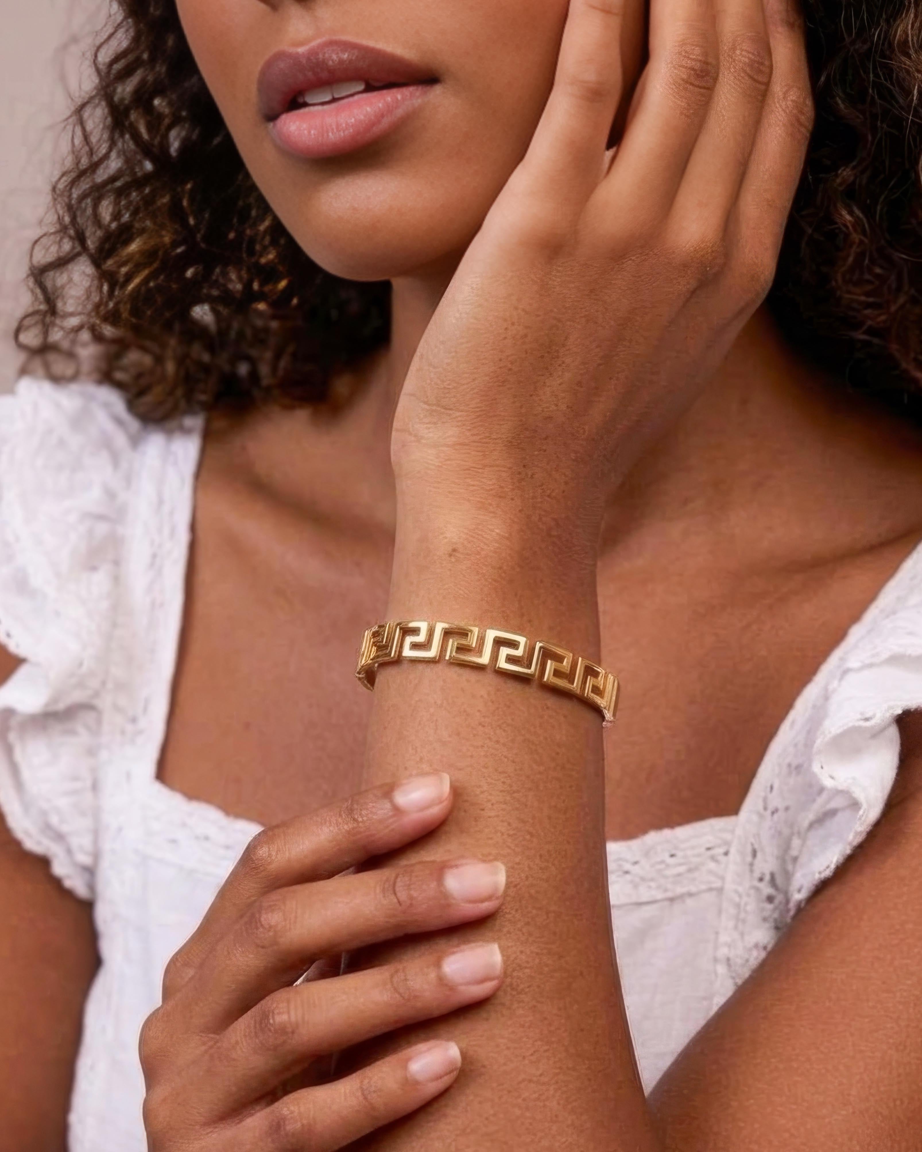 Model wearing 18K gold plated Greek key geometric bangle bracelet — HYFN