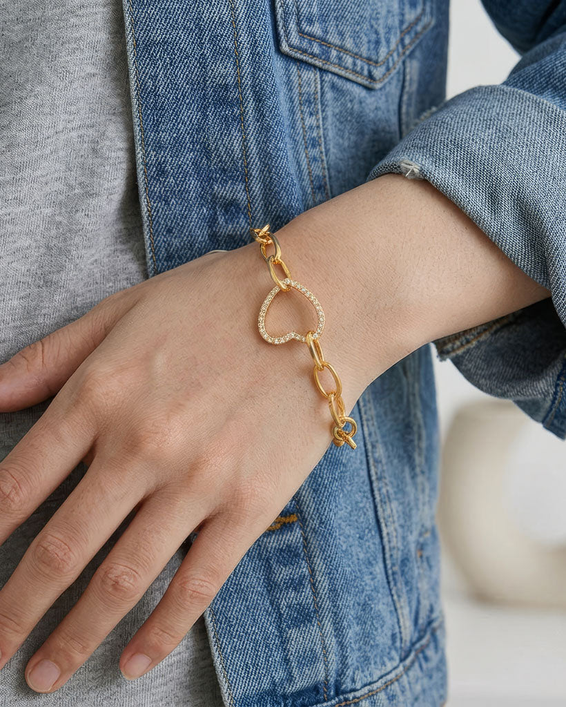 Model wearing 18K gold plated chain link bracelet with crystal heart charm — HYFN