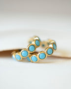 18K gold plated turquoise bezel ear cuffs styled on surface — HYFN
