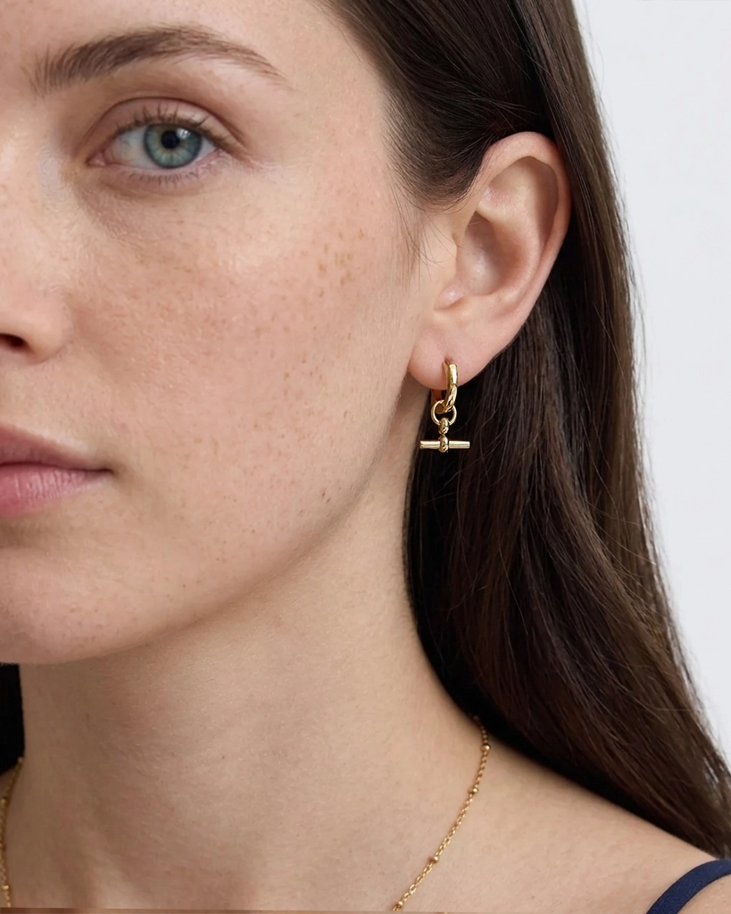 Model wearing 18K gold plated Marine T-bar hoop earring — HYFN