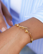 Model wearing 18K gold plated T-bar ball chain bracelet — HYFN